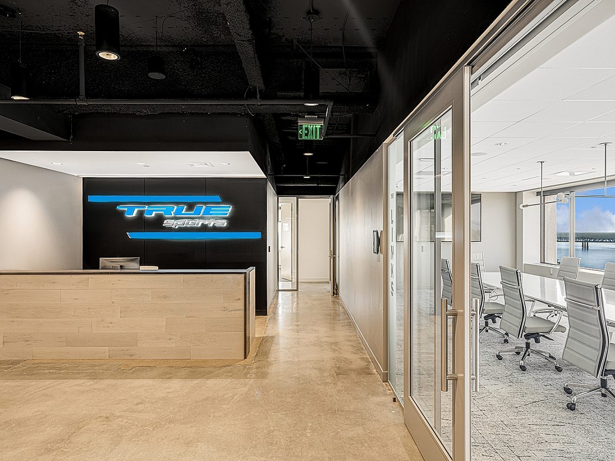 TrueSports office lobby with their logo and office furniture