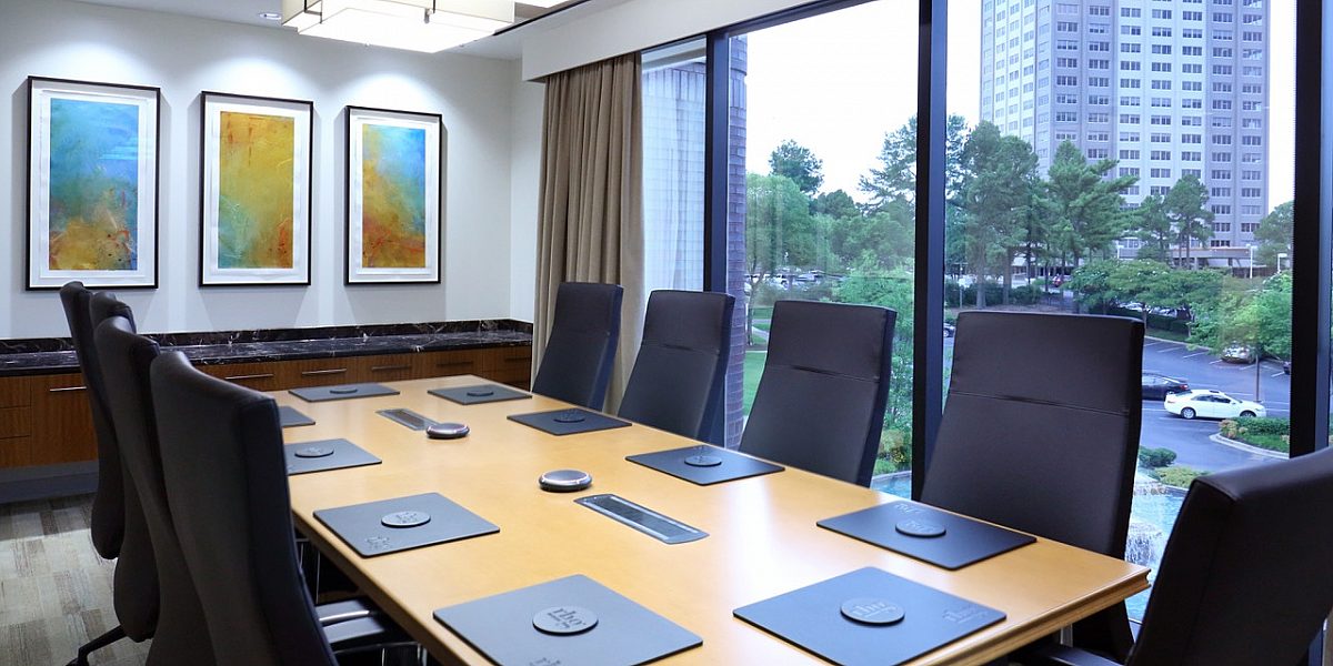 Conference room with large windows overlooking a city