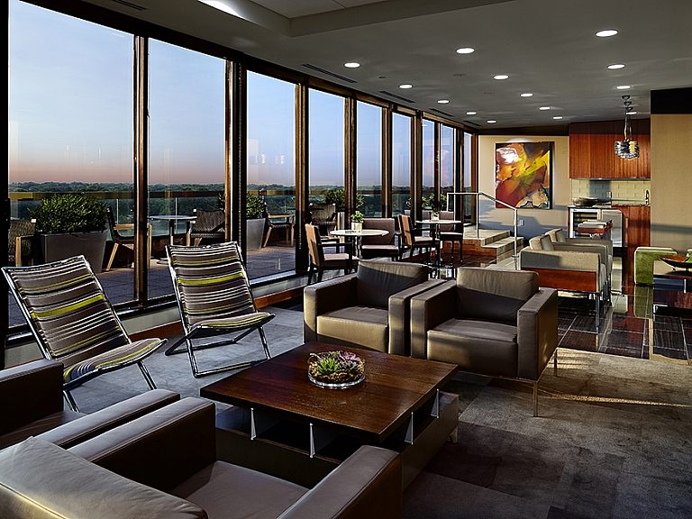 Lounge area at Adams Reese with the sunset coming through the windows