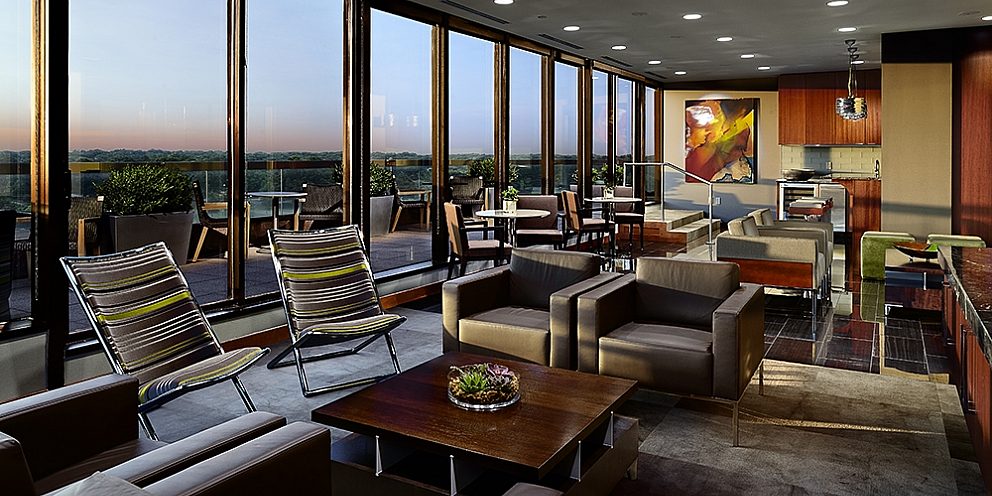 Lounge area at Adams Reese with the sunset coming through the windows