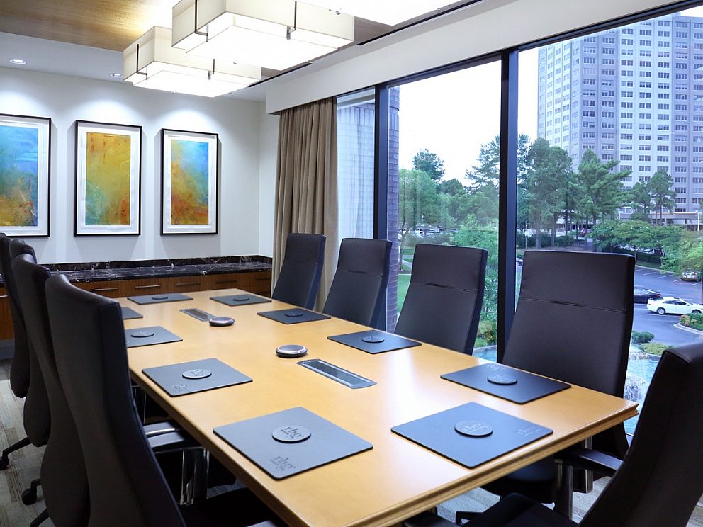 Conference room with large windows overlooking a city